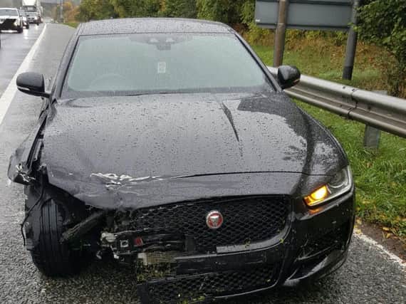 A smashed up Jaguar which came a-cropper in the rain today. Photo: West Yorkshire Police