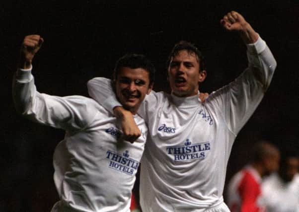 Gary Speed celebrates with Noel Whelan after heading Leeds United into the lead against PSV Eindhoven.
