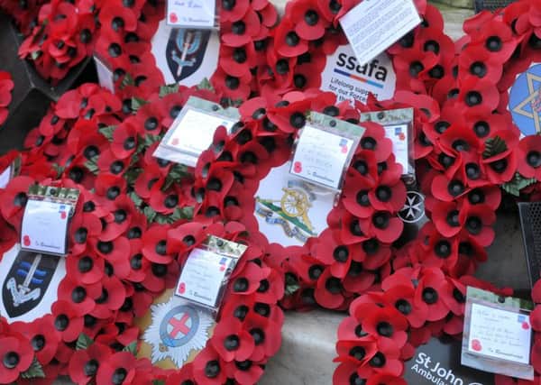 12 November 2017 .......     Wreaths laid at the Remembrance Day parade and ceremony at Leeds Cenotaph in Victoria Gardens.  Picture Tony Johnson