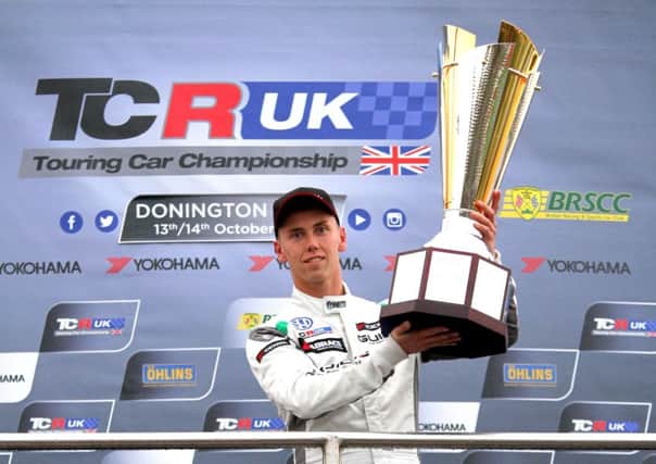 Daniel Lloyd with the TCR UK Championship trophy at Donington. Picture: Paul Horton Motorsport Photography.