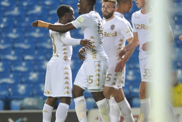 Leeds United's players celebrate with Caleb Ekuban after his maiden goal for the club in a League Cup tie against Port Vale.