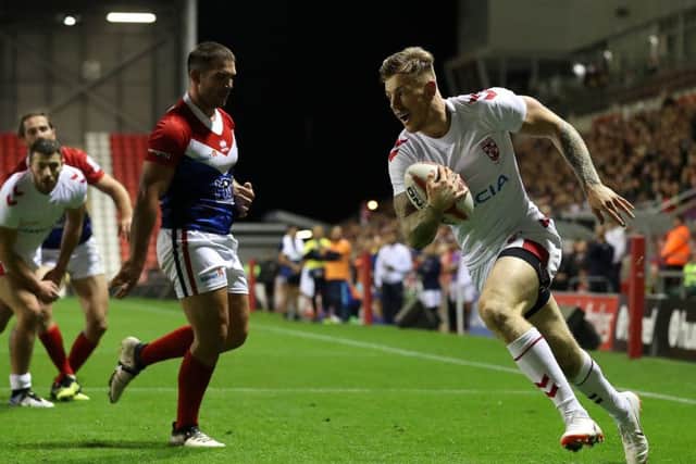 England's Tom Johnstone goes over for a try against France.