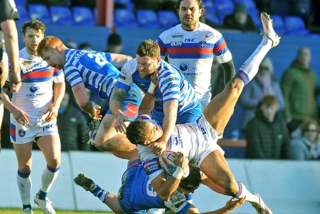 Simon Grix puts in a huge hit on Mason Caton-Brown