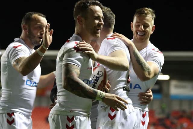 England's Richie Myler (centre) celebrates his try against France.