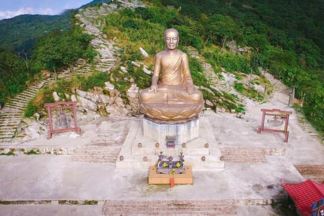 The golden Buddha at the top of Yen Tu Mountain. PIC: PA