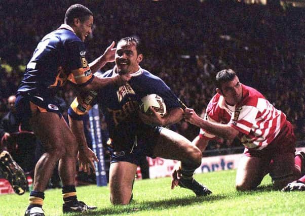 Richie Blackmore of Leeds (centre) is congratulated after scoring against Wigan in the Super League Final in 1998.