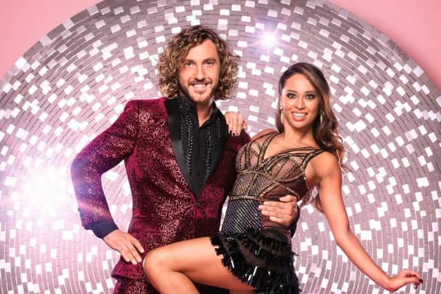 Seann Walsh and Katya Jones remain in the dancing competition, despite their kiss scandal.