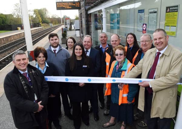 OPEN: Pete Myers, of Northern, cuts the ribbon to the newly-improved Garforth station.