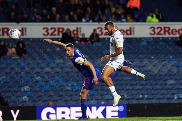 Kemar Roofe jumps above Matthew Pennington to head home Pablo Hernandez's cross and set Leeds United on course for victory over Ipswich Town.
