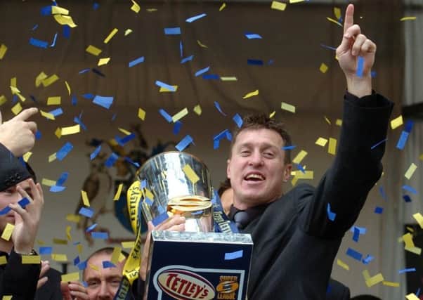 Leeds Rhinos departing Aussie Dave Furner holds the Super League trophy in Millennium Square to celebrate winning Super League Grand Final. 17 Oct 2004