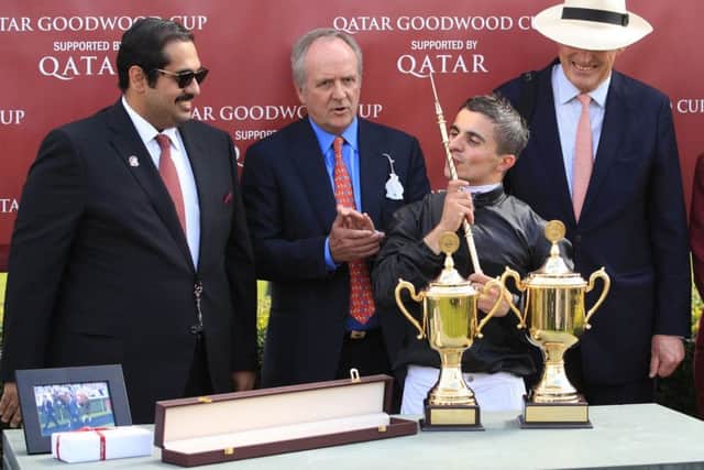 Jockey Andrea Atzeni (centre) celebrating with owner Bjorn Nielsen (second left) and trainer John Godsen (second right) after Stradivarius won the Qatar Goodwood Cup Stakes last year. PIC: John Walton/PA Wire