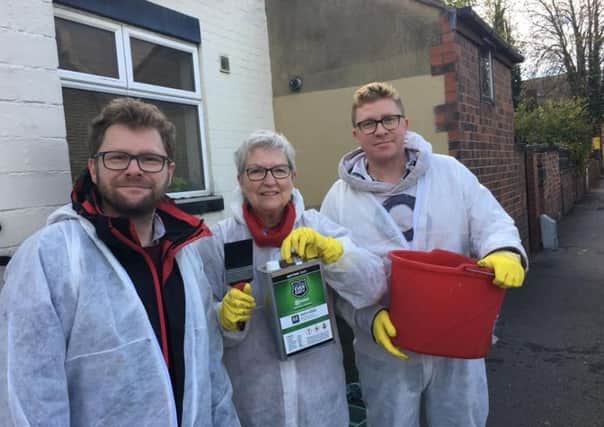 Headingley councillors Neil Walshaw, Al Garthwaite and Jonathan Pryor using anti-urine paint around the suburb.