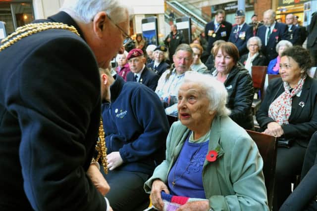 The Lord Mayor of Leeds, Coun Graham Latty, presents Winnie with her poppy at the appeal launch.