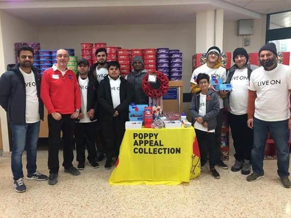 Members of the mosque at Morrisons collecting for the Poppy Appeal 2018