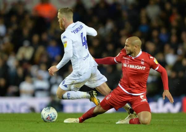 Adlene Guedioura brings Adam Forshaw down during Leeds United's 1-1 draw with Nottingham Forest.
