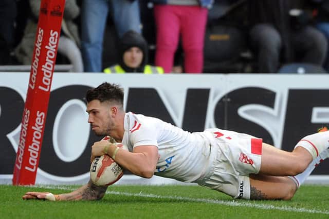 Oliver Gildart goes over for England's winning try.