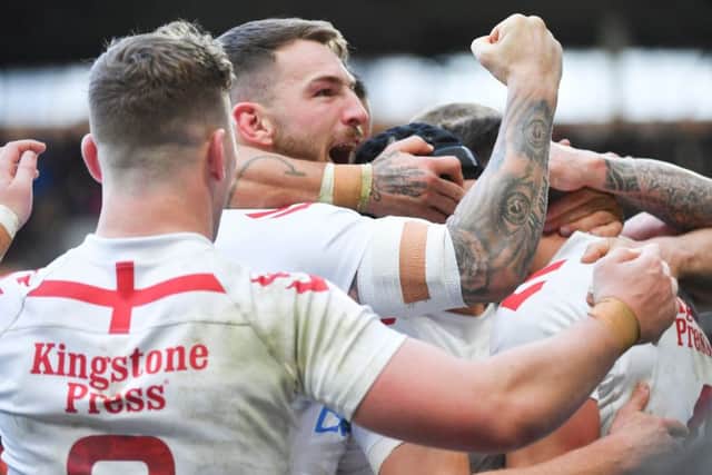 England players celebrate Oliver Gildart's try against New Zealand.