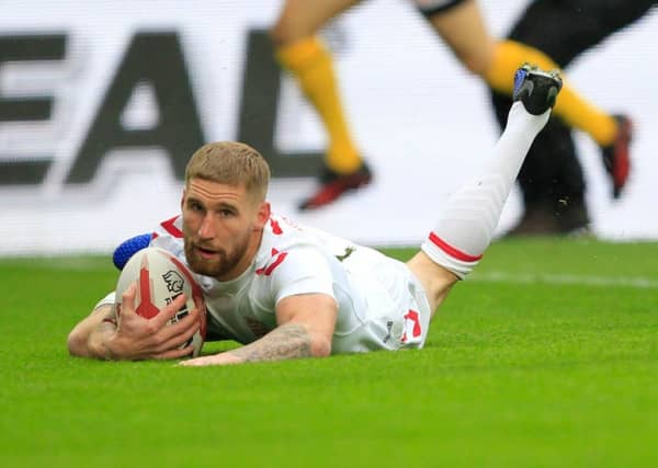 Sam Tomkins scores England's first try against New Zealand.