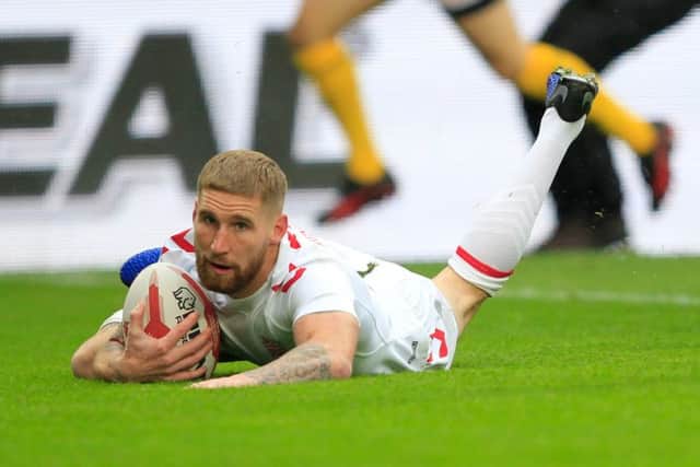 Sam Tomkins scores England's first try against New Zealand.
