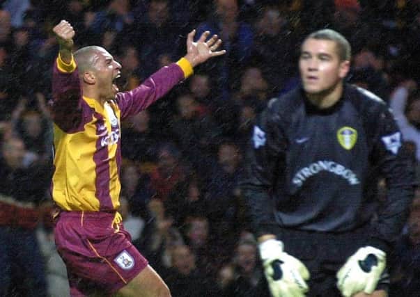 Stan Collymore celebrates his opening goal for Bradford City while Leeds goalkeeper Paul Robinson looks dejected during the Premiership clash Sunday October 29, 2000 at Valley Parade. PIC:: John Giles/PA Wire
