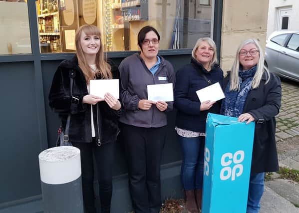 Solidarity: Aimee Inskip, left, pictured with colleague Vicky Cullerton and her mum, Lotty Inskip with Louise Kavanagh at the Co-op.