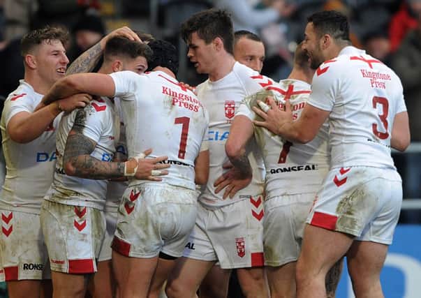 England players celebrate Oliver Gildart's winning try against New Zealand.