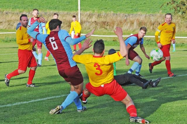 Aiden Barry scores for Rawdon OB to make the score level with Aberford, 3-3. PIC: Steve Riding