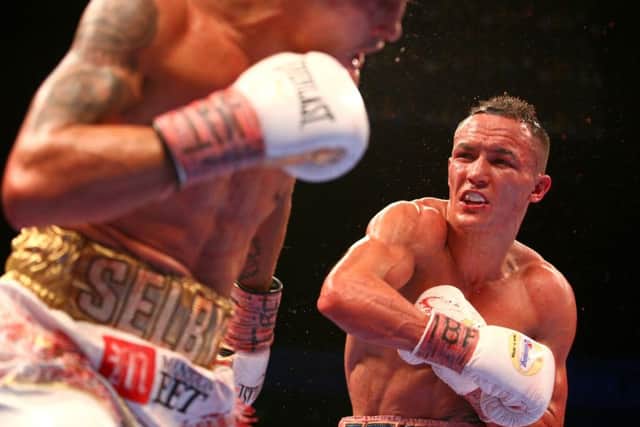 Lee Selby (left) feels the full weight of Josh Warrington's punching. PIC: Dave Thompson/PA Wire