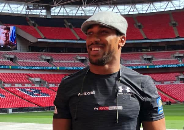 Anthony Joshua wears the Kempadoo Millar flat cap at Wembley before his fight with Alexander Povetkin.
