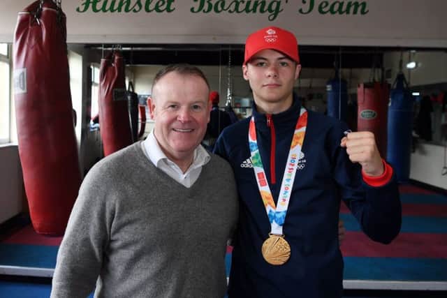 Leeds' newly-crowned Youth Olympics gold medallist boxer Hope Price with his trainer Dennis Robbins. PIC: Jonathan Gawthorpe