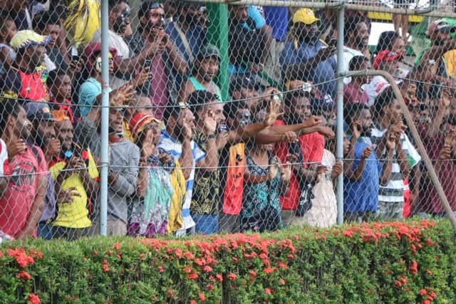 Papua New Guinea fans cheer on their team in the first Test against England Knights.