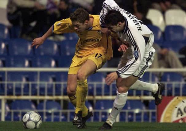 FLASHBACK: Alan Smith and Real Madrid's Aitor Karanka in 2001.