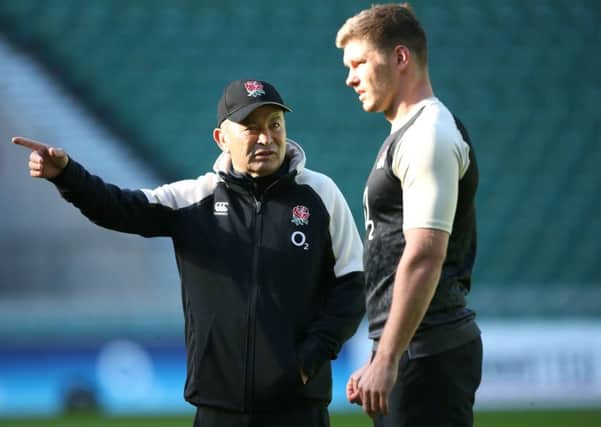 THIS IS THE WAY: England head coach Eddie Jones (left) with fly-half Owen Farrell during yesterday's training session at Twickenham. Picture: Adam Davy/PA.