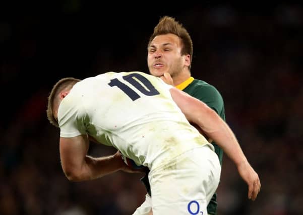 England's Owen Farrell tackles South Africa's Andre Esterhuizen at Twickenham. Picture: Adam Davy/PA