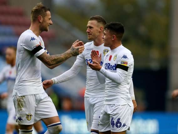 Leeds United players celebrate at full-time.