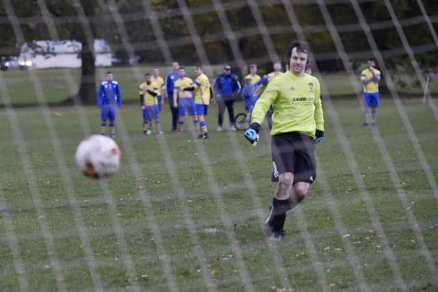 Shire goalkeeper Matt Strangwood scores in the penalty shootout with Drig. PIC: Steve Riding