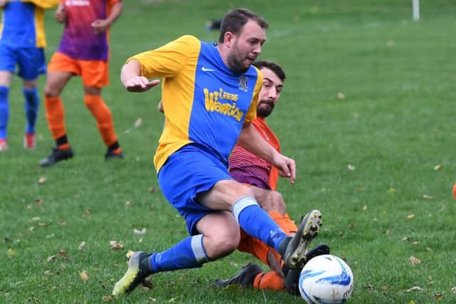 Hope Inn's Shaun Mallory is tackled by Bramley's Nick Carlton. PIC: Jonathan Gawthorpe