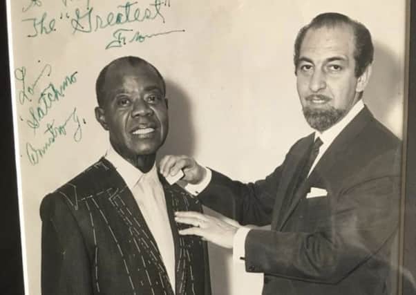Louis Armstrong and Max Freeman.