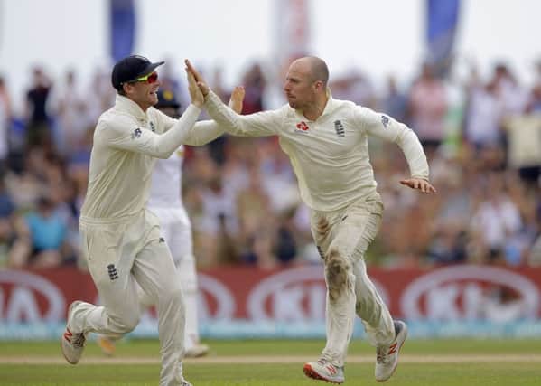 England's Jack Leach celebrates the dismissal of Sri Lanka's Kusal Mendis with teammate Joss Buttler in Galle. Picture: AP/Eranga Jayawardena