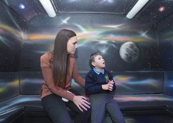 First Bus

The bus donated by First West Yorkshire to Broomfield South School in Leeds, West Yorkshire, and which has then been fitted out by different partners.

Staff member Naomi Lyons with pupil Henry in the space themed sensory room on board the bus.


Photograph by Richard Walker - www.imagenorth.net
