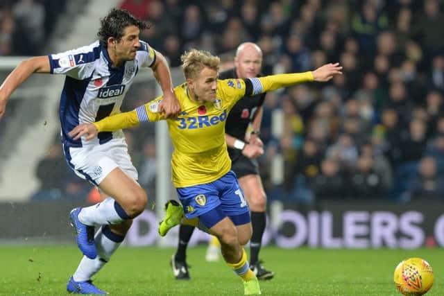 Ahmed Hegali and Samuel Saiz chase the ball.