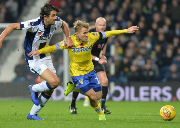 Ahmed Hegali and Samuel Saiz chase the ball.