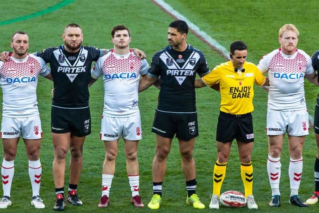 Players and officials stood shoulder to shoulder to observe the minute's silence before the Armistice Sunday game. PIC: Alex Whitehead/SWpix.com