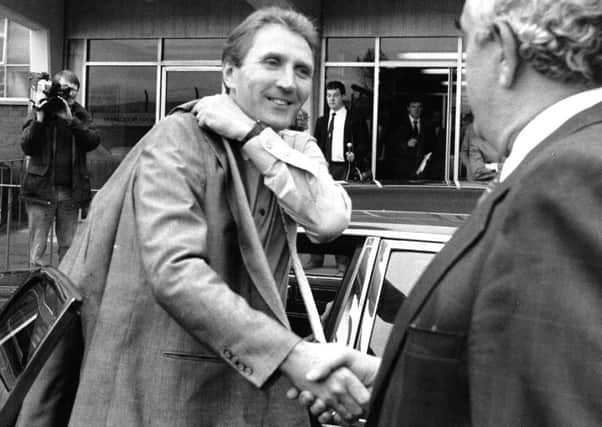 Howard Wilkinson arriving at Elland Road to be greeted by Leslie Silver to start his new job as manager in October 1988. PIC: Yorkshire Post Newspapers