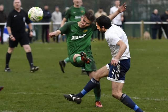 Beeston St Anthony's Reece Farnhill scores against Leeds City. PIC: Steve Riding