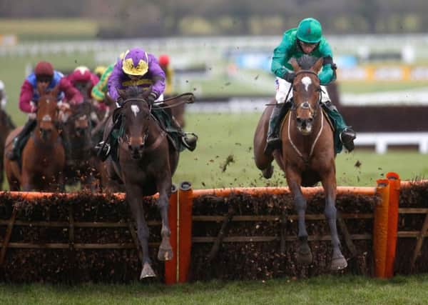 Wholestone and Daryl Jacob, right, in action at Cheltenham in January this year. PIC: Julian Herbert/PA Wire