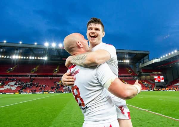 England's Chris Hill and John Bateman celebrate victory over New Zealand at Anfield.