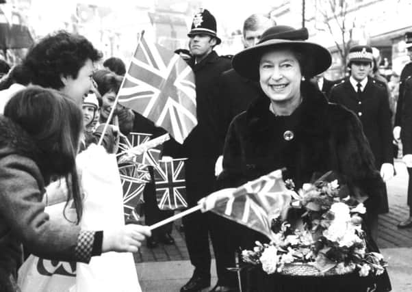 Wakefield, 26th November 1982

Enthusiastic crowds lean forward to greet the Queen during her visit to the Wakefield pedestrian precinct today.