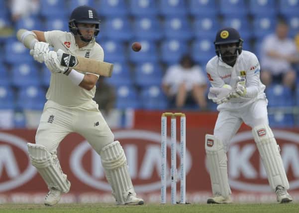 England's Sam Curran plays a shot as Sri Lanka's Niroshan Dickwella watches during the first day of the second test with Sri Lanka. (AP Photo/Eranga Jayawardena)