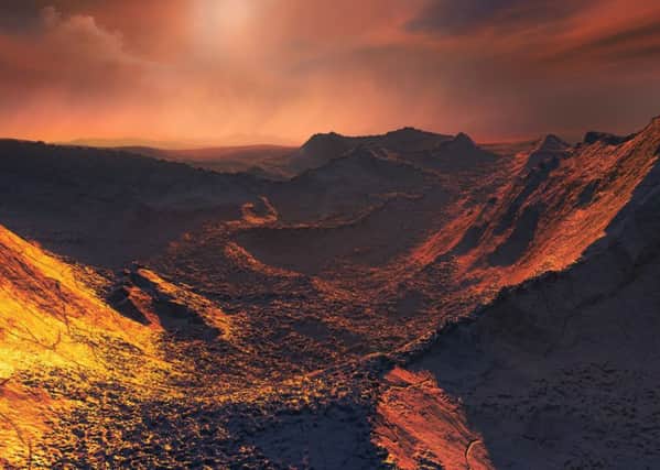 An artist impression issued by the Open University of Barnard's star planet under the orange tinted light from the star.